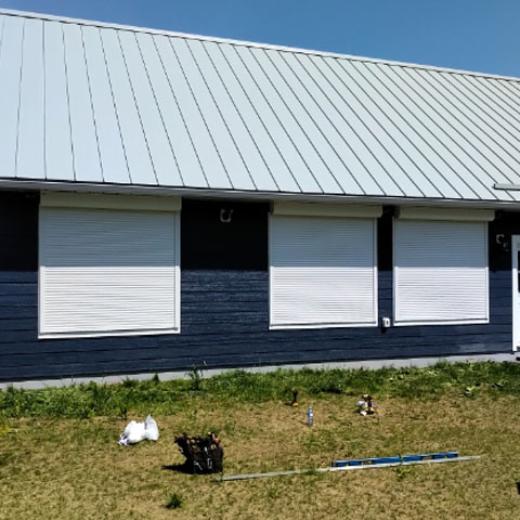 roll pro shutters over farm window